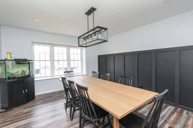 a view of a dining table and chairs in a room