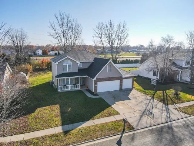 an aerial view of a house with a swimming pool