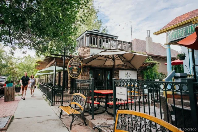 a view of a cafe with sitting area