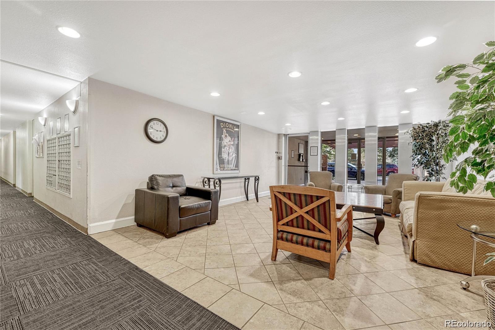 2500 South York Street, Unit 401 Denver, CO 80210 - Photo 2 of 18 a living room with furniture a rug and a window