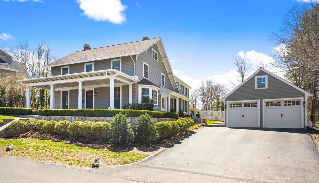 a view of a white house with a yard in front of it
