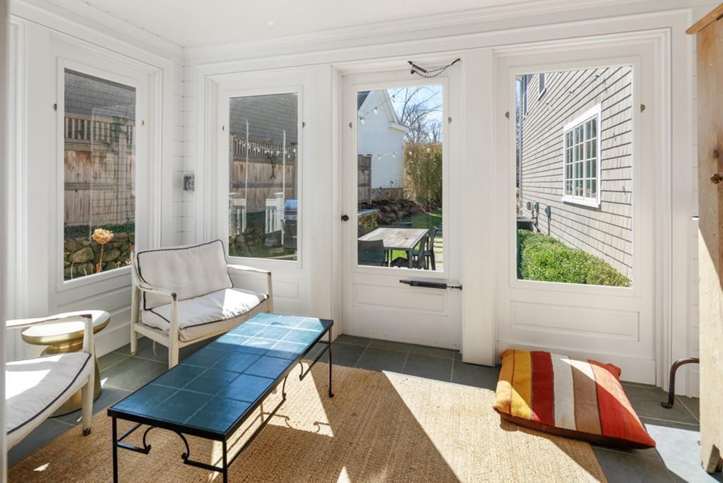 73 Winter Street Hingham, MA 02043 - Photo 17 of 42 a living room with a couch and a window