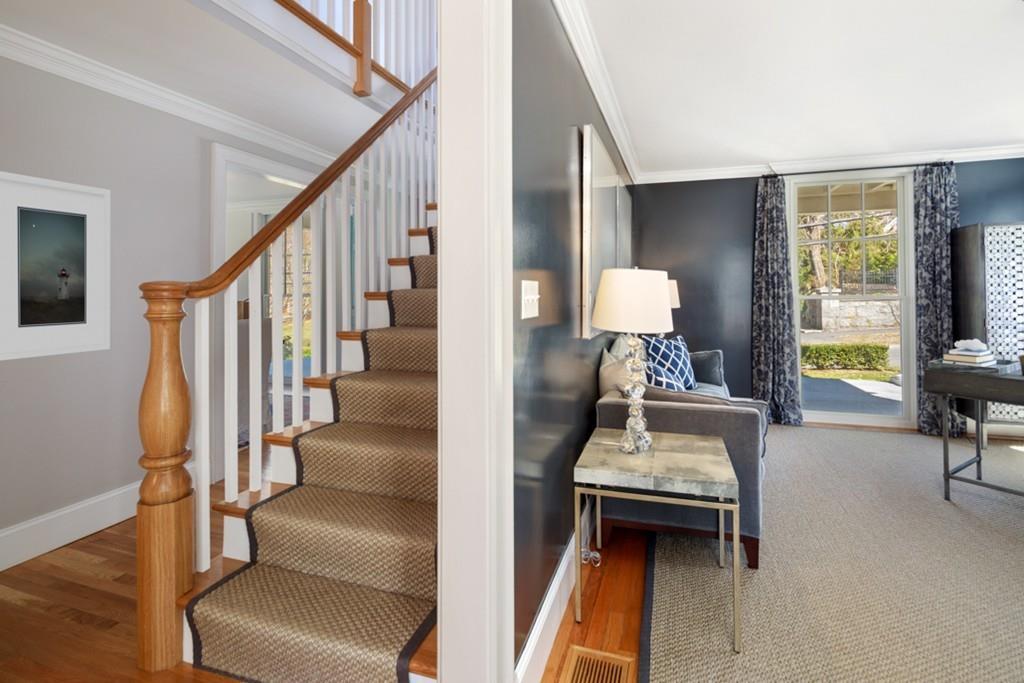 73 Winter Street Hingham, MA 02043 - Photo 18 of 42 a room with stairs and a view of living room