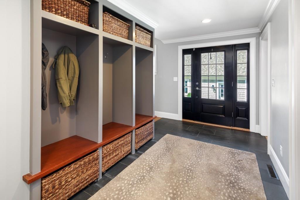 73 Winter Street Hingham, MA 02043 - Photo 20 of 42 a hallway with sliding door and wooden floor