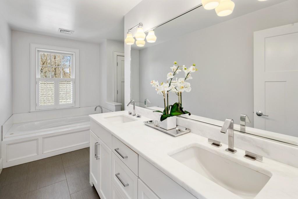 73 Winter Street Hingham, MA 02043 - Photo 24 of 42 a bathroom with a sink a tub and a mirror