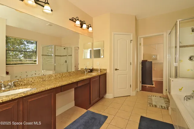 a view of a bedroom with wooden floor and closet