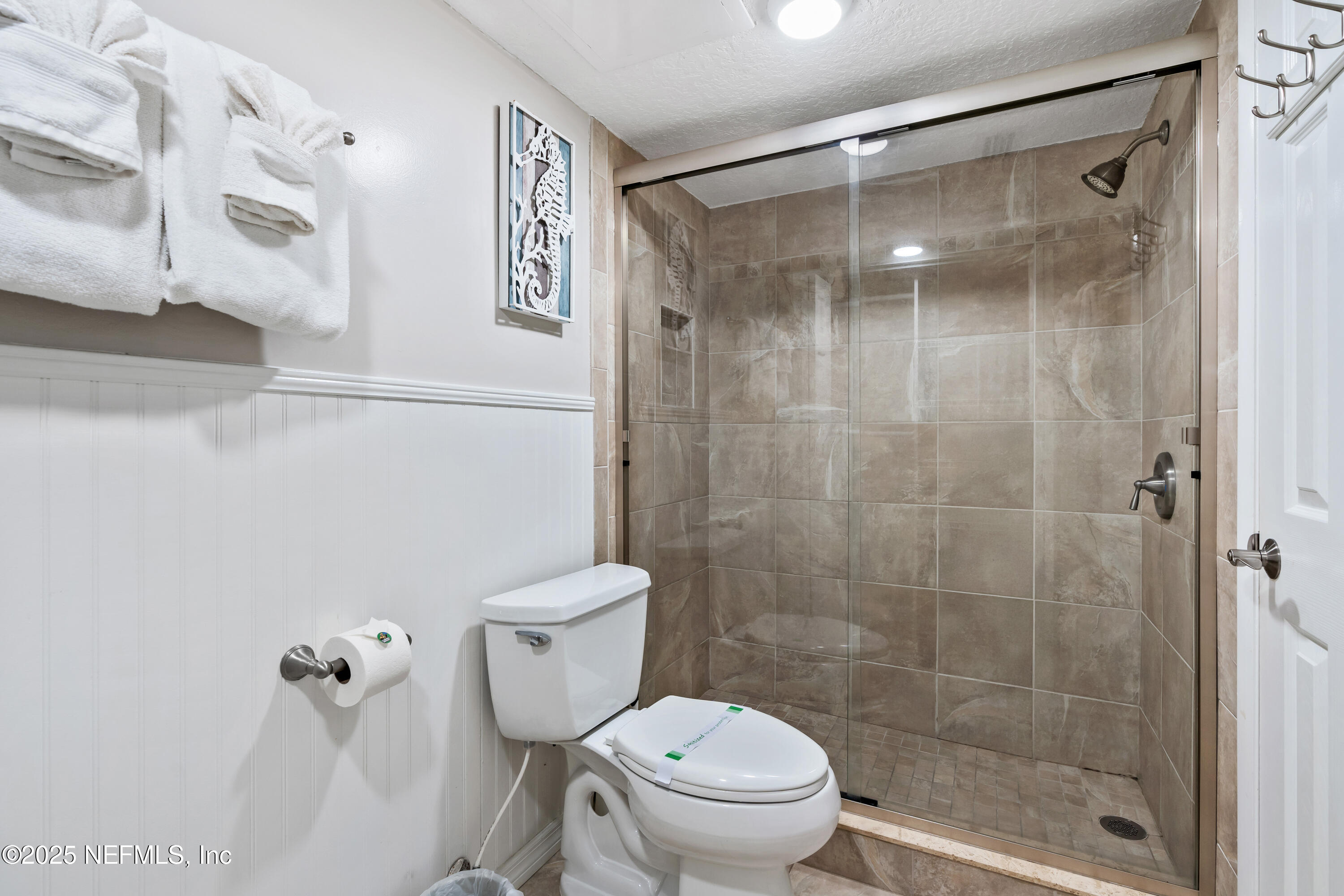 2 Dondanville Road, Unit 207 St. Augustine, FL 32080 - Photo 20 of 65 a bathroom with a shower a toilet and a sink