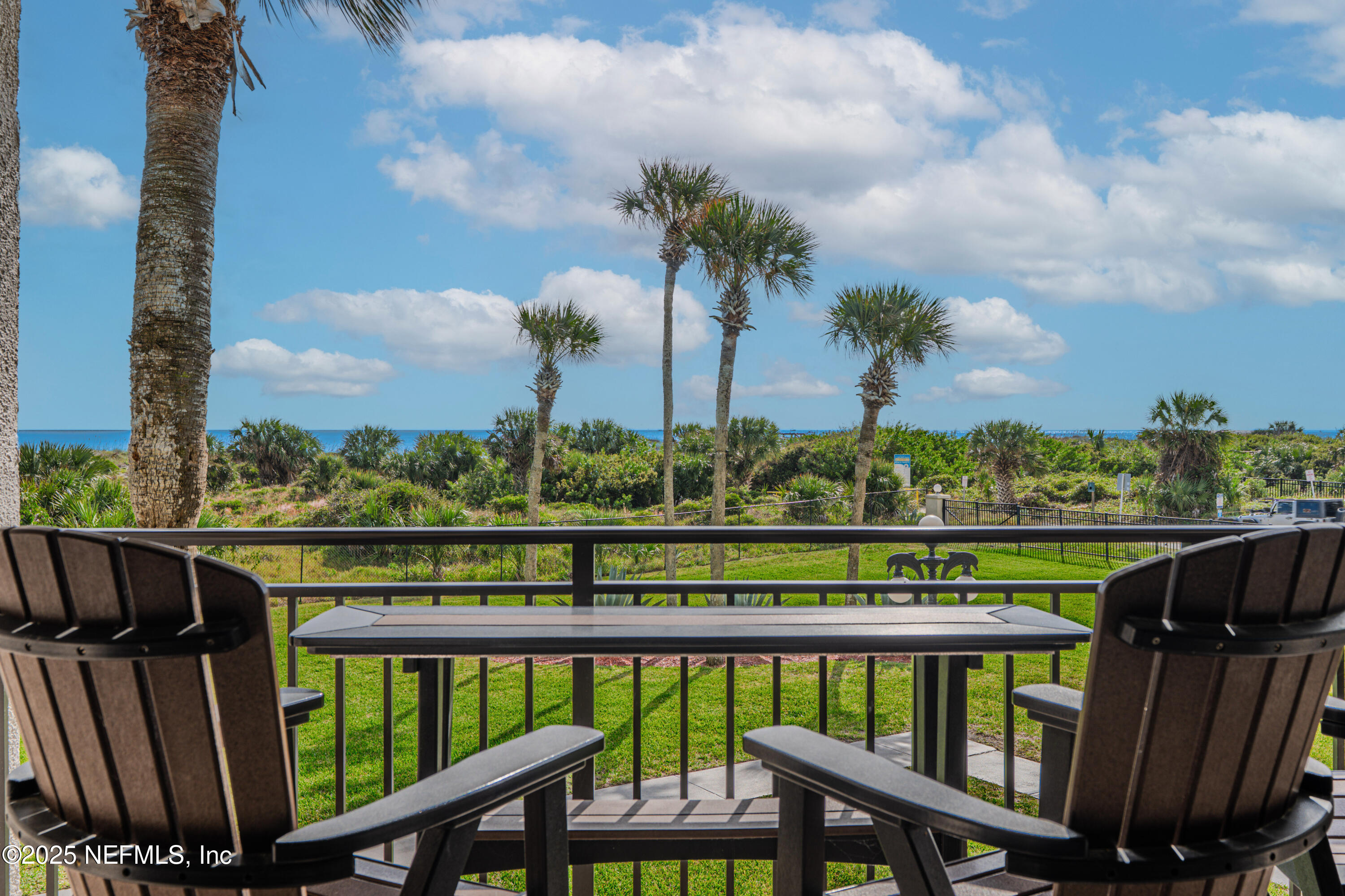 2 Dondanville Road, Unit 207 St. Augustine, FL 32080 - Photo 2 of 65 a view of a balcony with wooden floor & fence