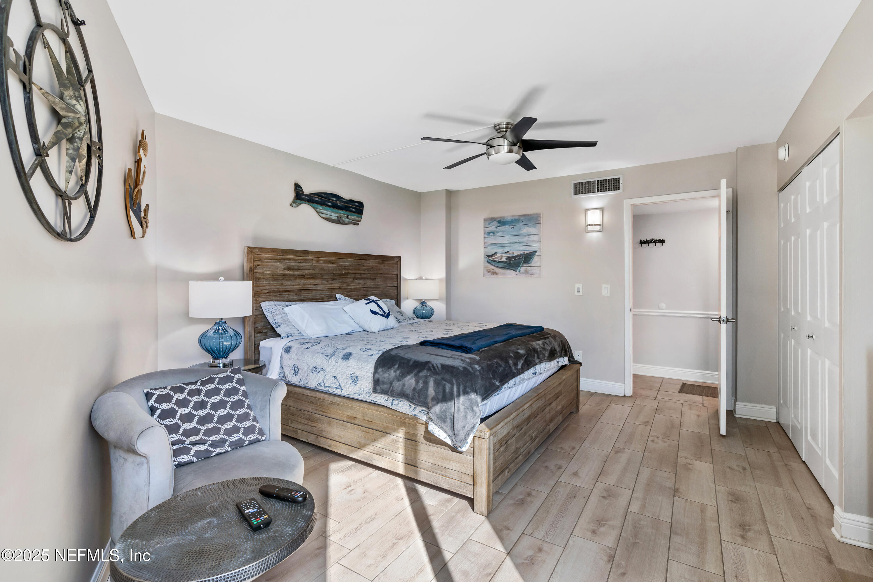 2 Dondanville Road, Unit 207 St. Augustine, FL 32080 - Photo 25 of 65 a bedroom with a bed and a chandelier