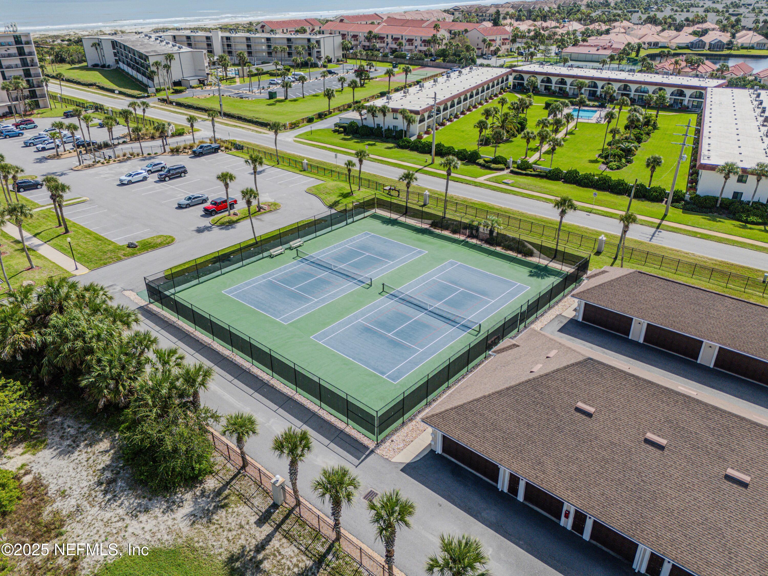 2 Dondanville Road, Unit 207 St. Augustine, FL 32080 - Photo 48 of 65 an aerial view of a tennis ground and a cars park side of the road