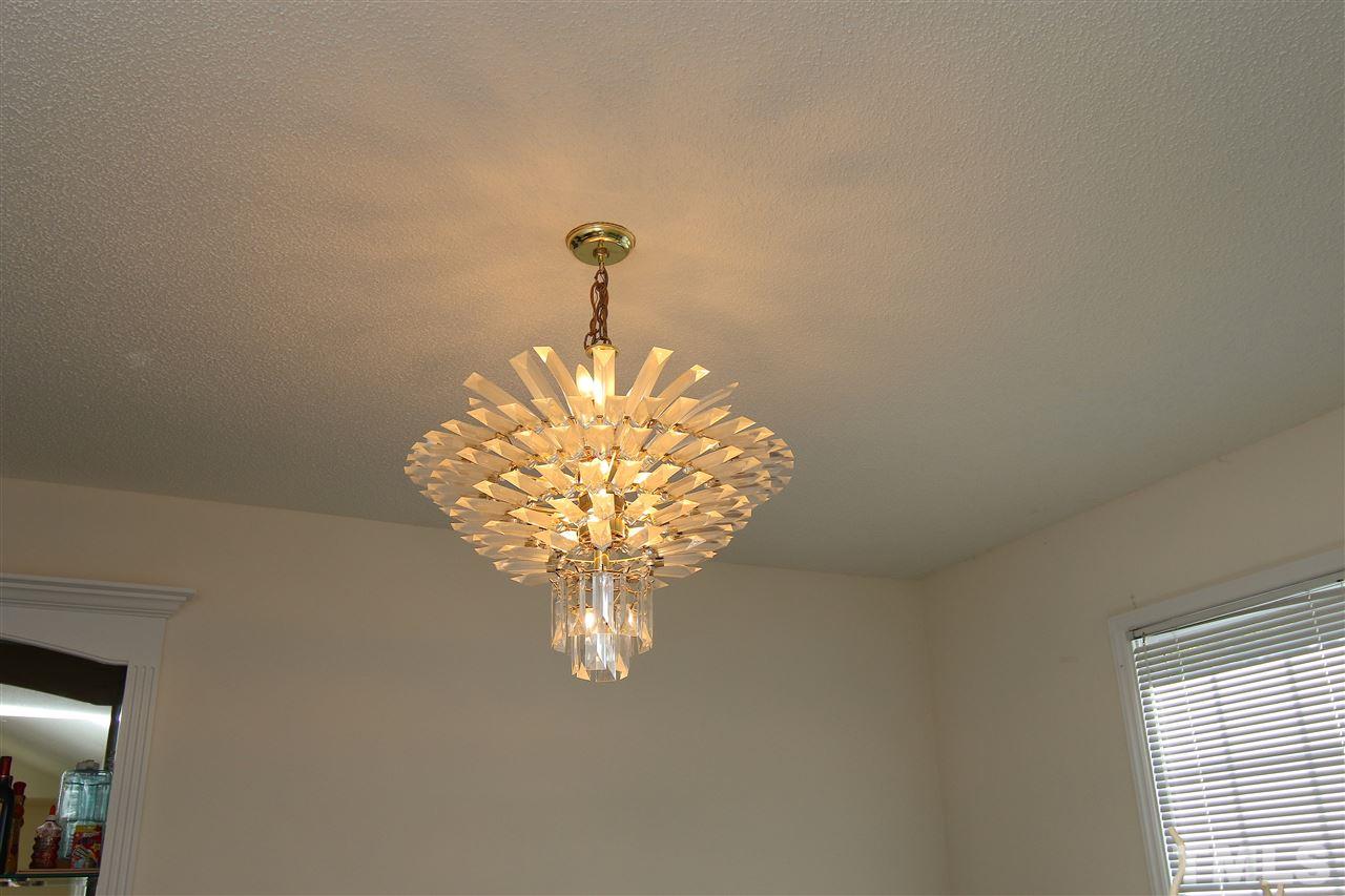 420 Quail Road Smithfield, NC 27577 - Photo 6 of 24 Chandelier in Dining Room