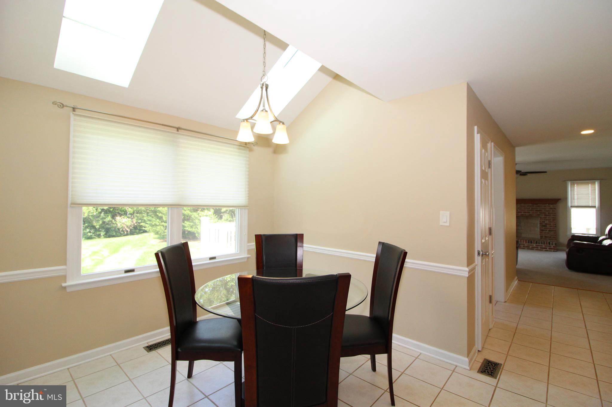 3831 Rotherfield Lane Chadds Ford, PA 19317 - Photo 8 of 43 Eat-in Area with Vaulted Ceiling & Skylights