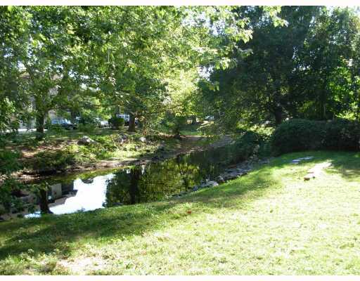 Undisclosed Address Stamford, CT 06905 - Photo 4 of 4 a view of a garden from a bench