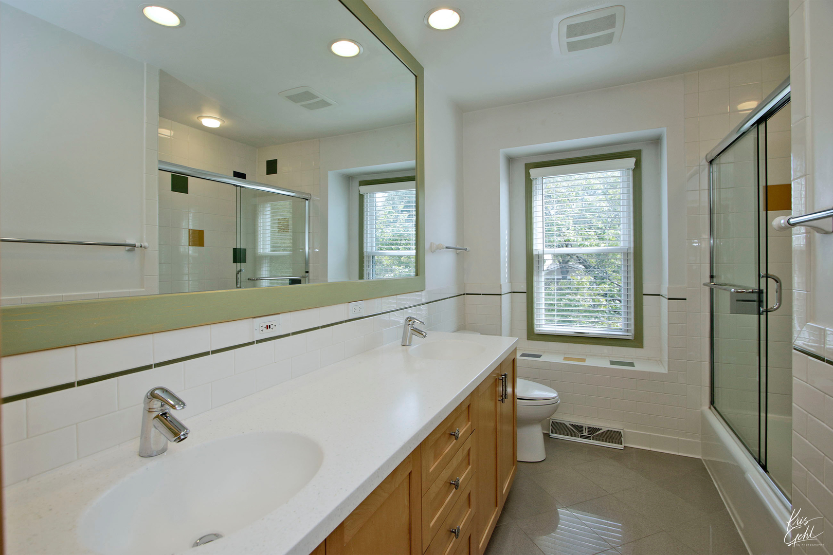 2143 Valley Road Northbrook, IL 60062 - Photo 19 of 26 a bathroom with a tub sink and a window