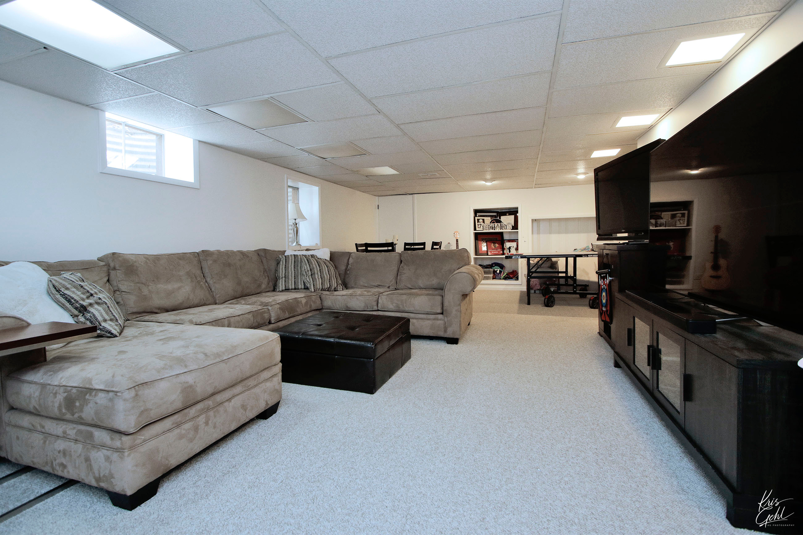2143 Valley Road Northbrook, IL 60062 - Photo 20 of 26 a living room with furniture and a flat screen tv