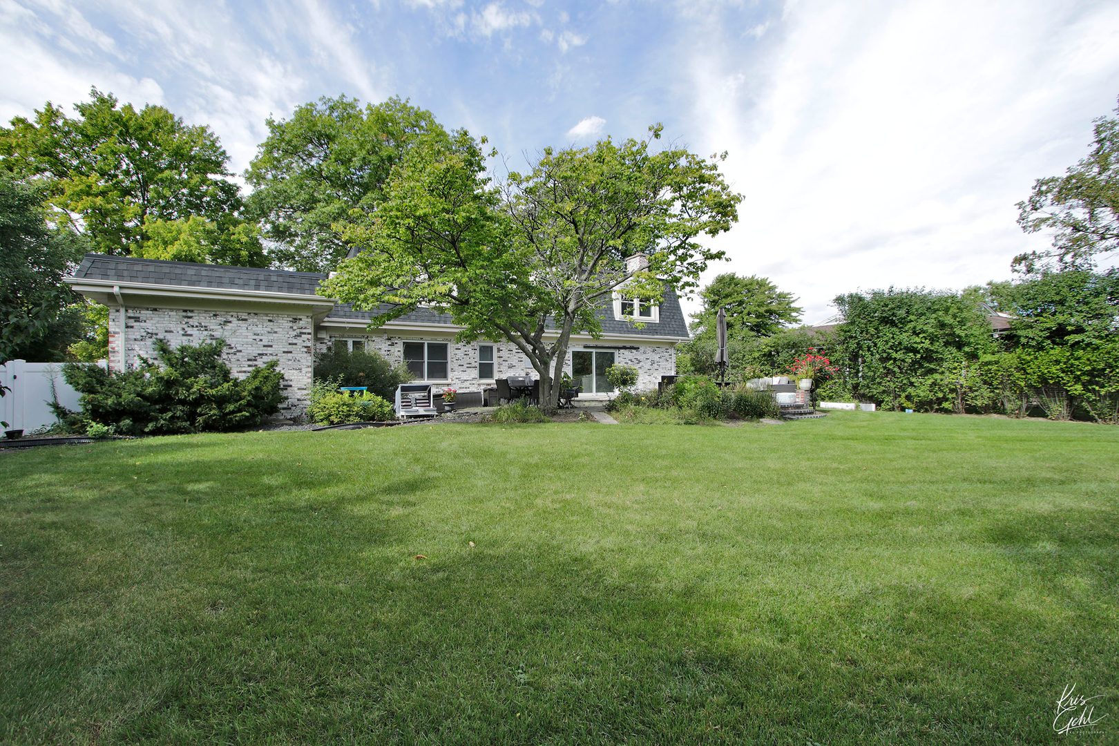 2143 Valley Road Northbrook, IL 60062 - Photo 25 of 26 a view of a house with backyard sitting area and garden