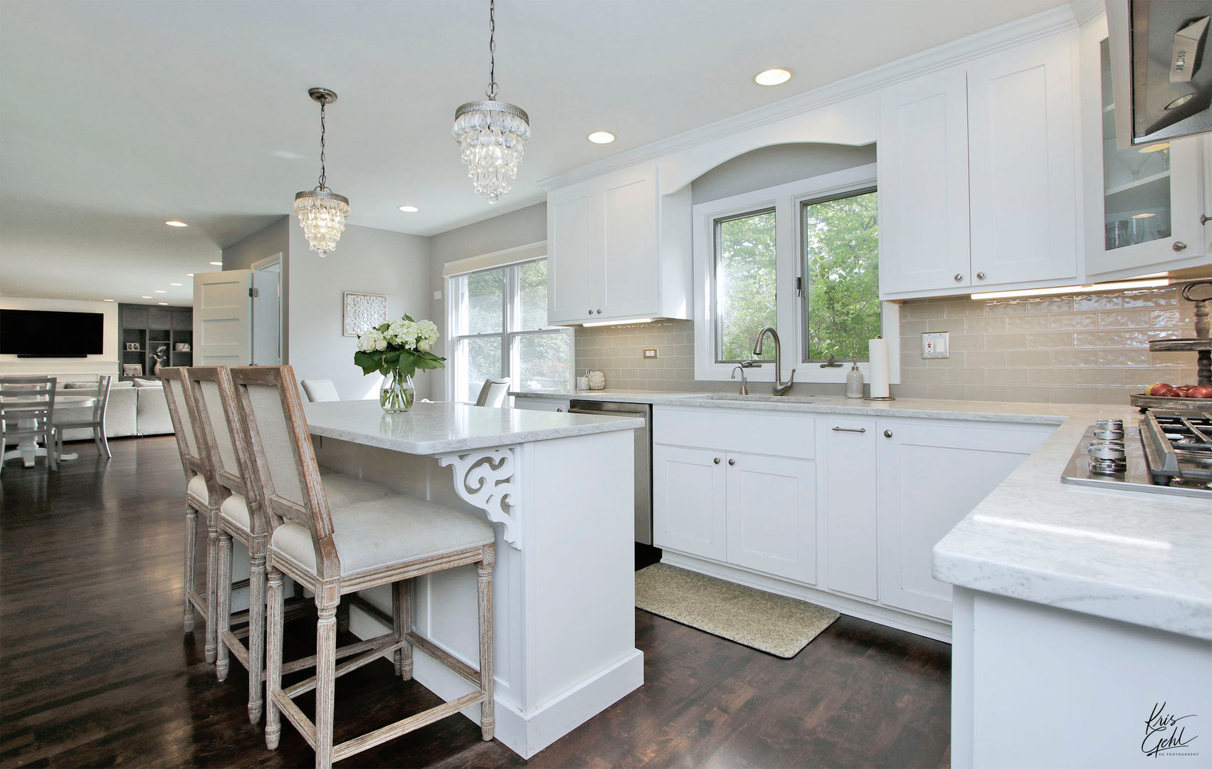 2143 Valley Road Northbrook, IL 60062 - Photo 6 of 26 a kitchen with kitchen island a dining table chairs sink and cabinets