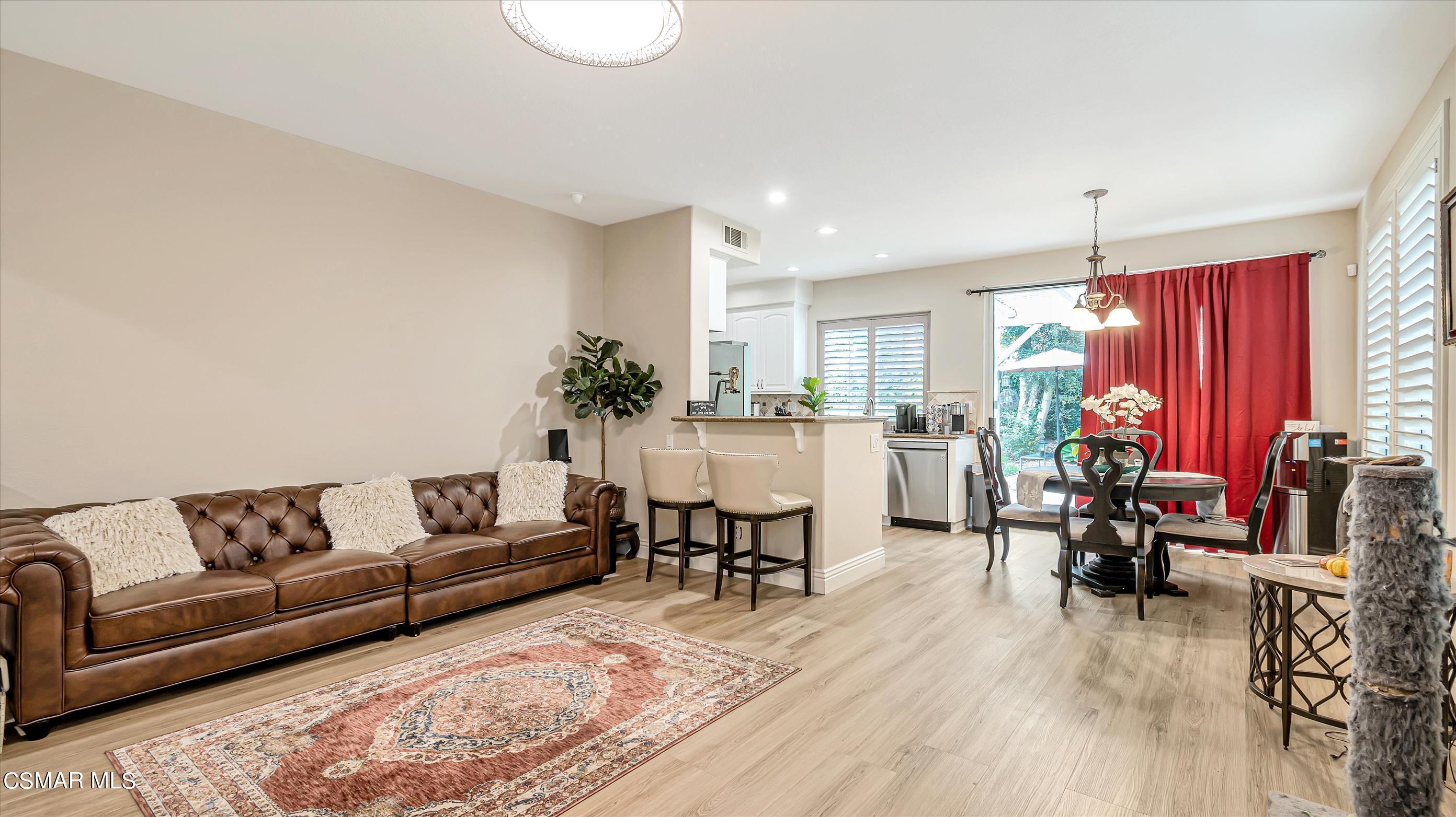 11695 Sagewood Drive Moorpark, CA 93021 - Photo 11 of 31 a living room with furniture dining table and a potted plant