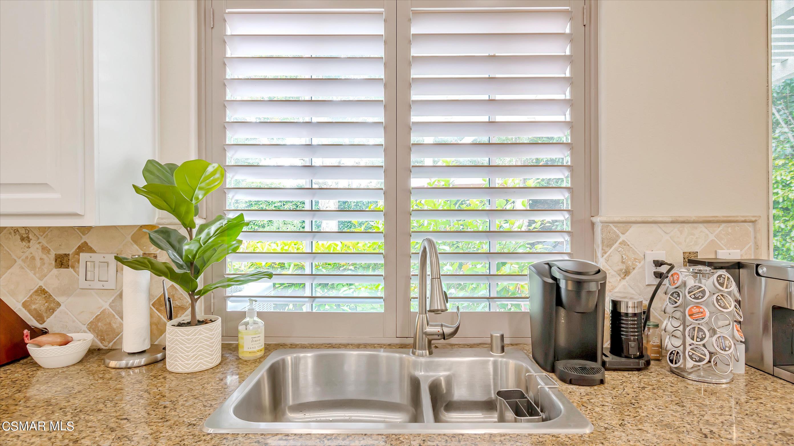 11695 Sagewood Drive Moorpark, CA 93021 - Photo 14 of 31 a kitchen with a sink and a window