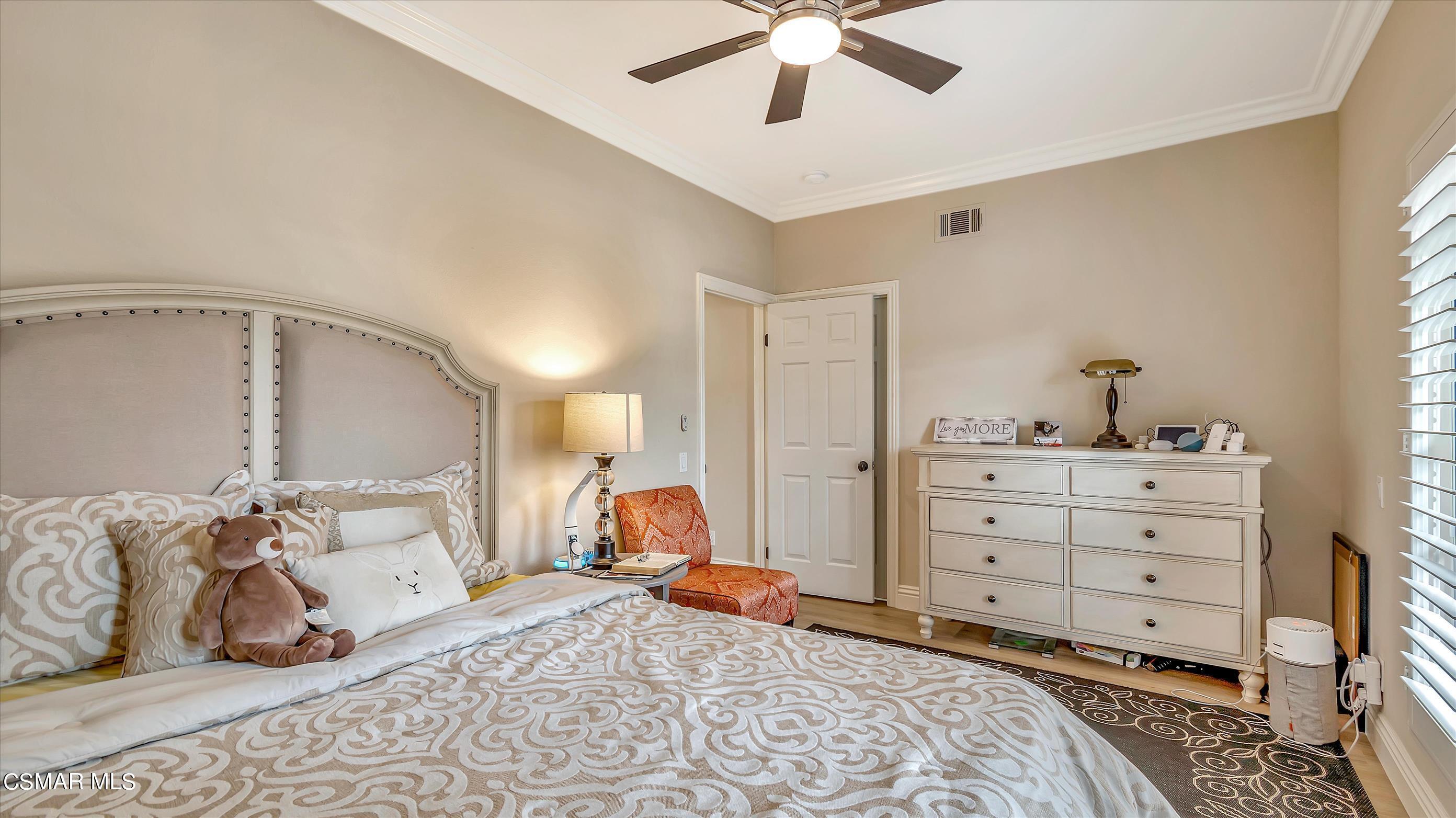 11695 Sagewood Drive Moorpark, CA 93021 - Photo 25 of 31 a bed room with a bed and a television