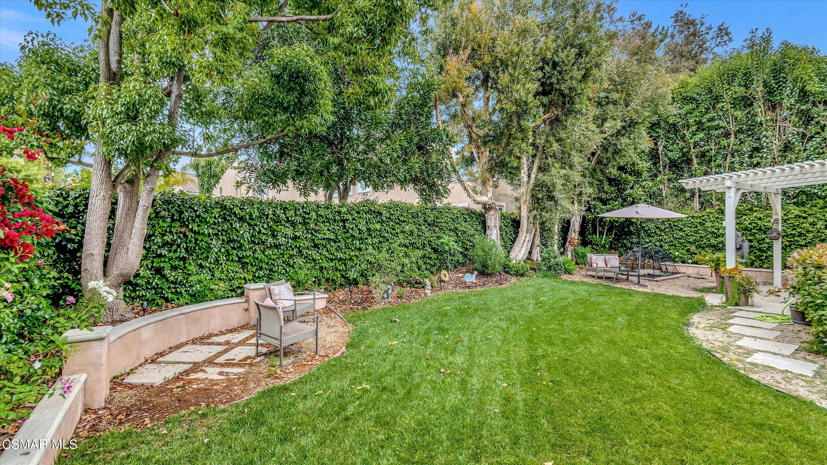11695 Sagewood Drive Moorpark, CA 93021 - Photo 30 of 31 a view of a chair and table in the garden