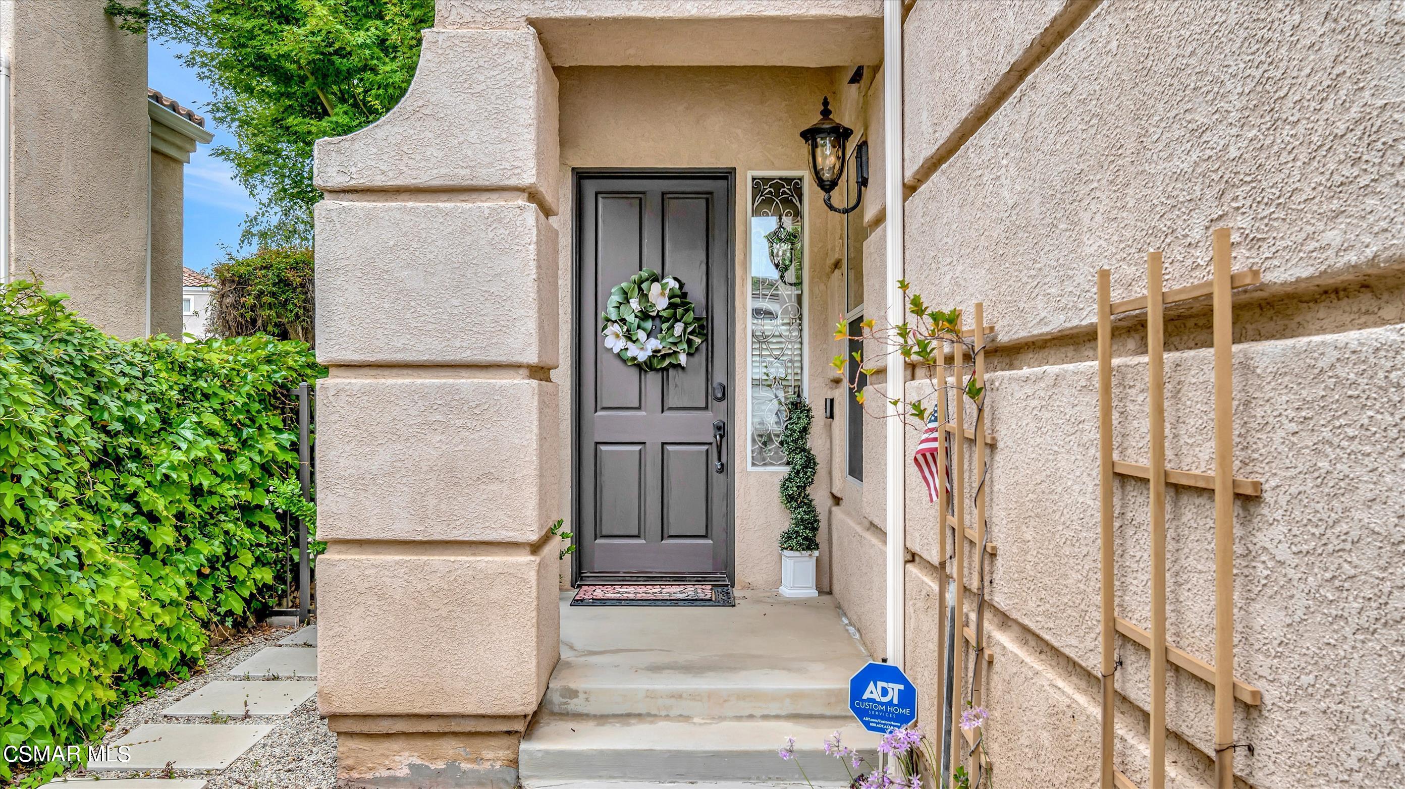 11695 Sagewood Drive Moorpark, CA 93021 - Photo 4 of 31 a view of front door and potted plants
