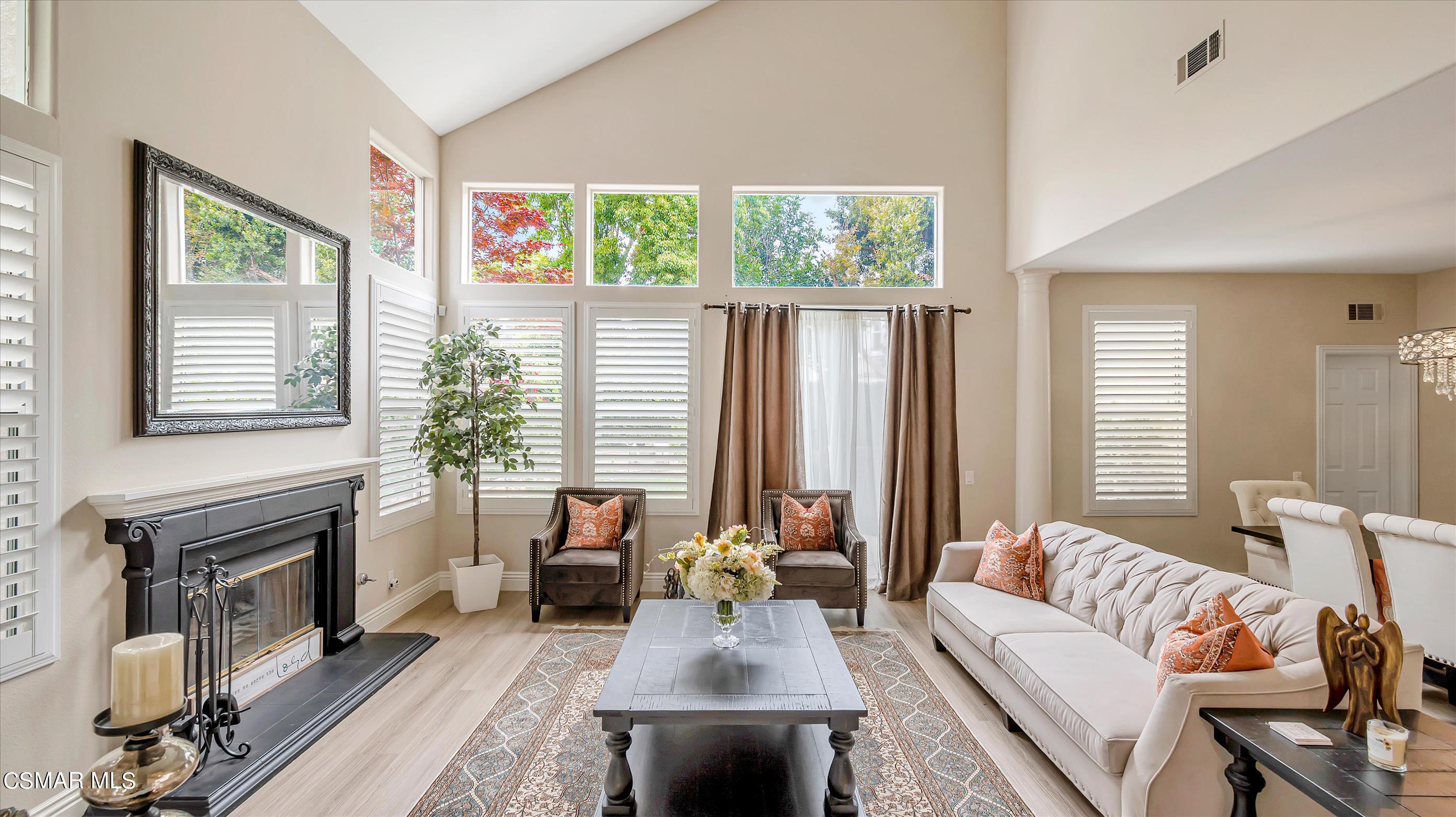 11695 Sagewood Drive Moorpark, CA 93021 - Photo 7 of 31 a living room with furniture and a fireplace