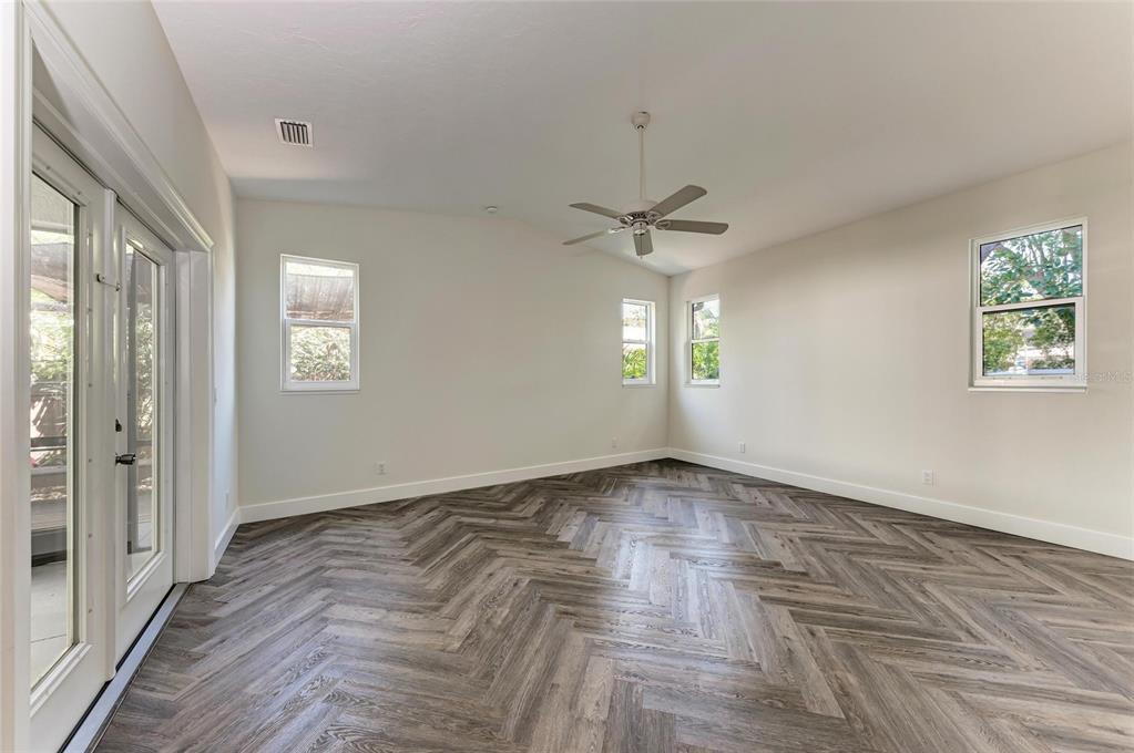 51 Webb Street Osprey, FL 34229 - Photo 23 of 56 wooden floor in an empty room with a window