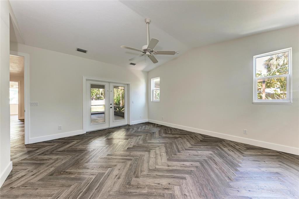 51 Webb Street Osprey, FL 34229 - Photo 26 of 56 wooden floor in an empty room with a window