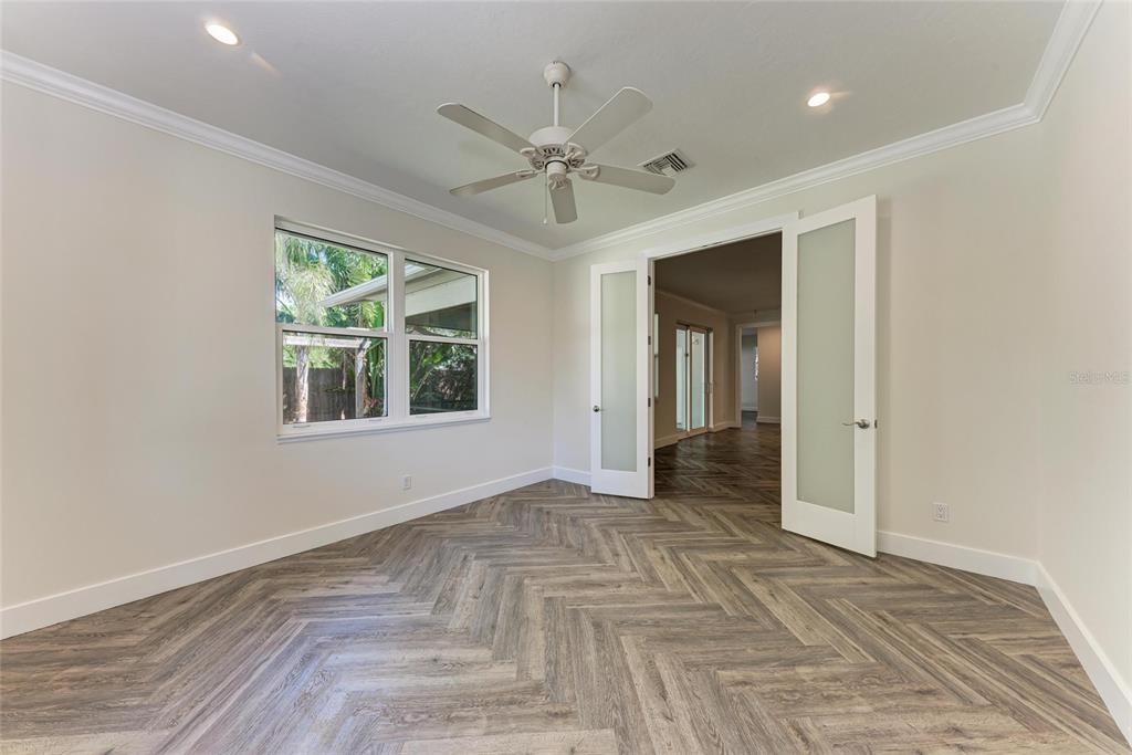 51 Webb Street Osprey, FL 34229 - Photo 33 of 56 wooden floor in an empty room with a window