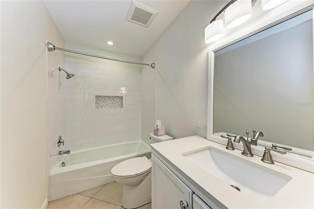 51 Webb Street Osprey, FL 34229 - Photo 41 of 56 a bathroom with a sink a toilet and shower