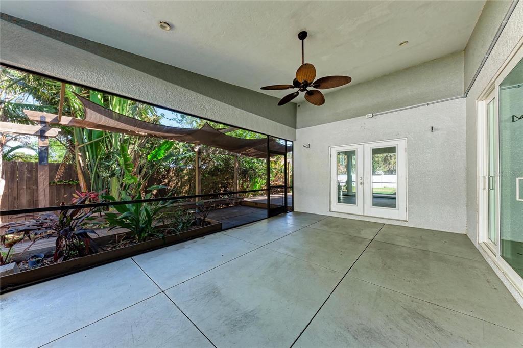 51 Webb Street Osprey, FL 34229 - Photo 44 of 56 a view of an empty room with a window and a ceiling fan