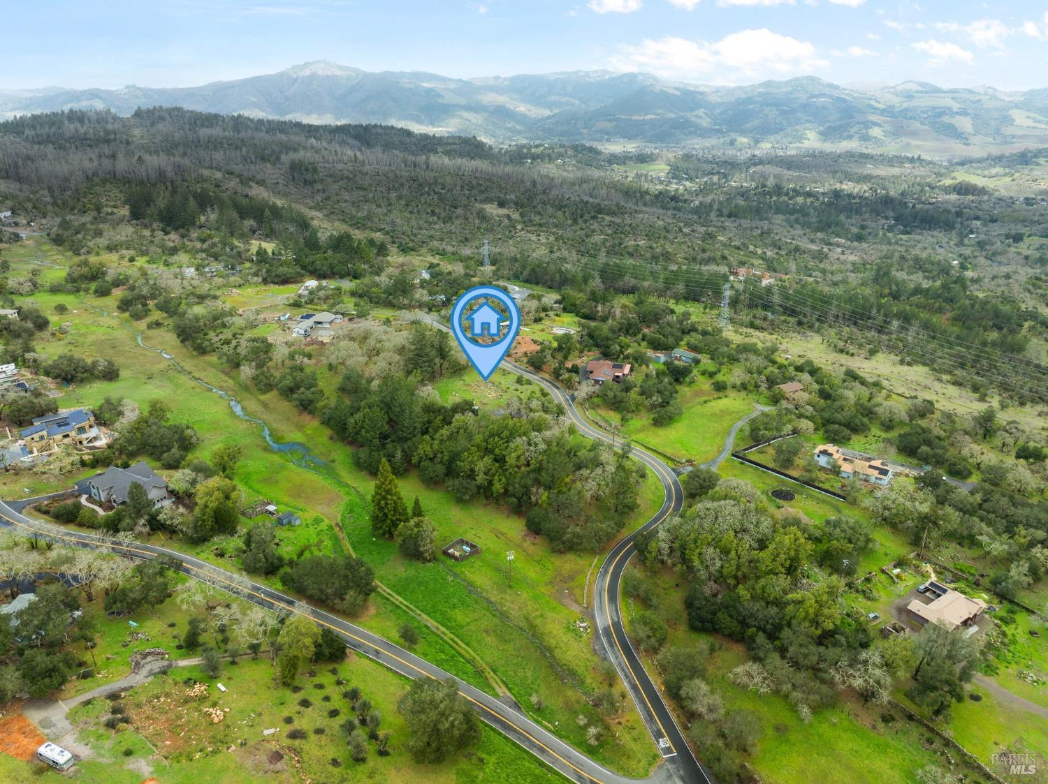 2924 Old Bennett Ridge Road Santa Rosa, CA 95404 - Photo 7 of 21 a view of a lush green field with a mountain in the background