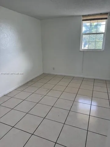 a view of a livingroom and entryway