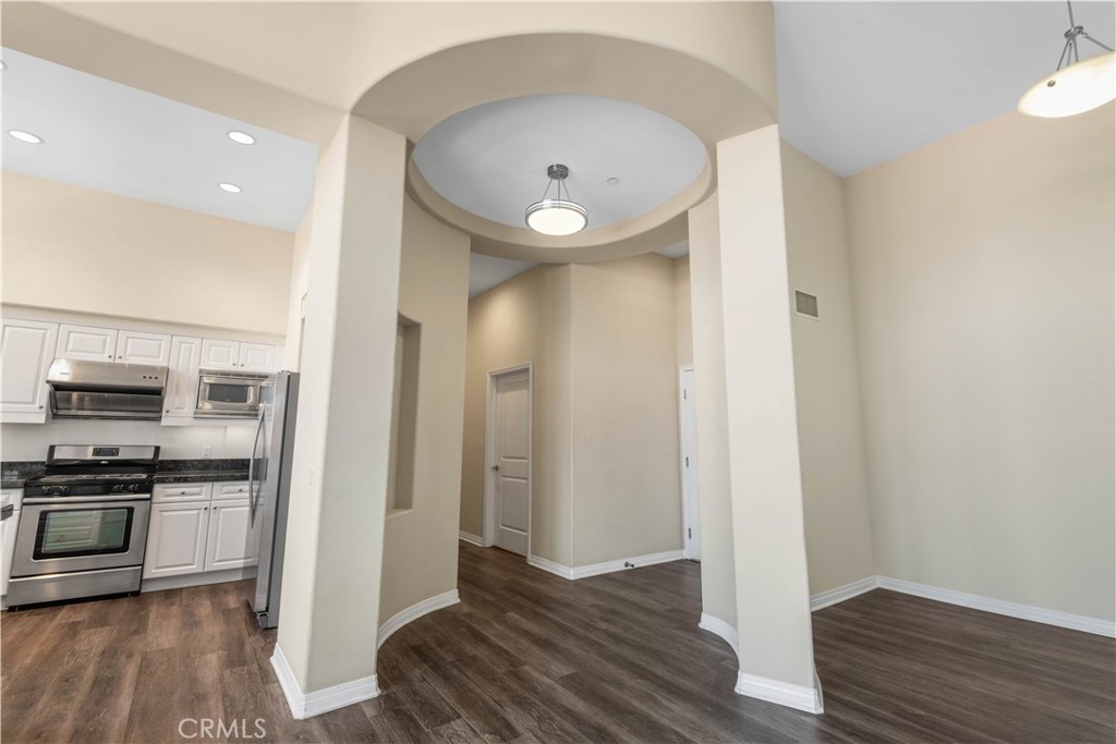 a view of kitchen with sink and stainless steel appliances