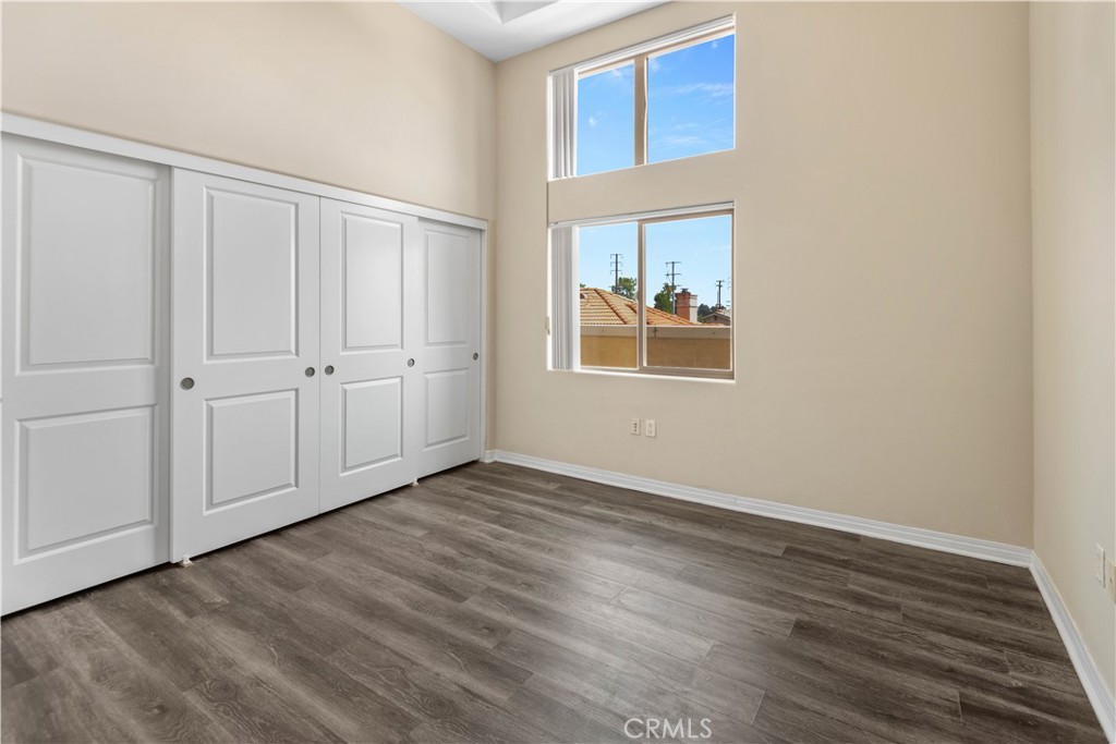 600 North Atlantic Boulevard, Unit 213 Monterey Park, CA 91754 - Photo 11 of 28 a view of an empty room with wooden floor and a window