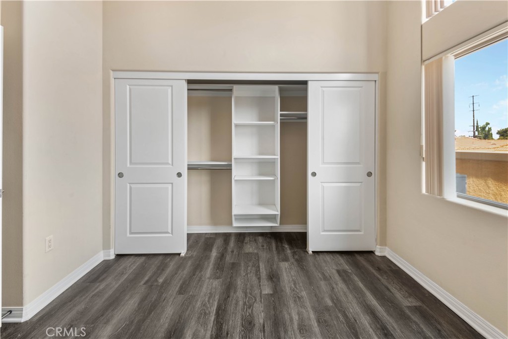 600 North Atlantic Boulevard, Unit 213 Monterey Park, CA 91754 - Photo 12 of 28 a view of an empty room with wooden floor and a window