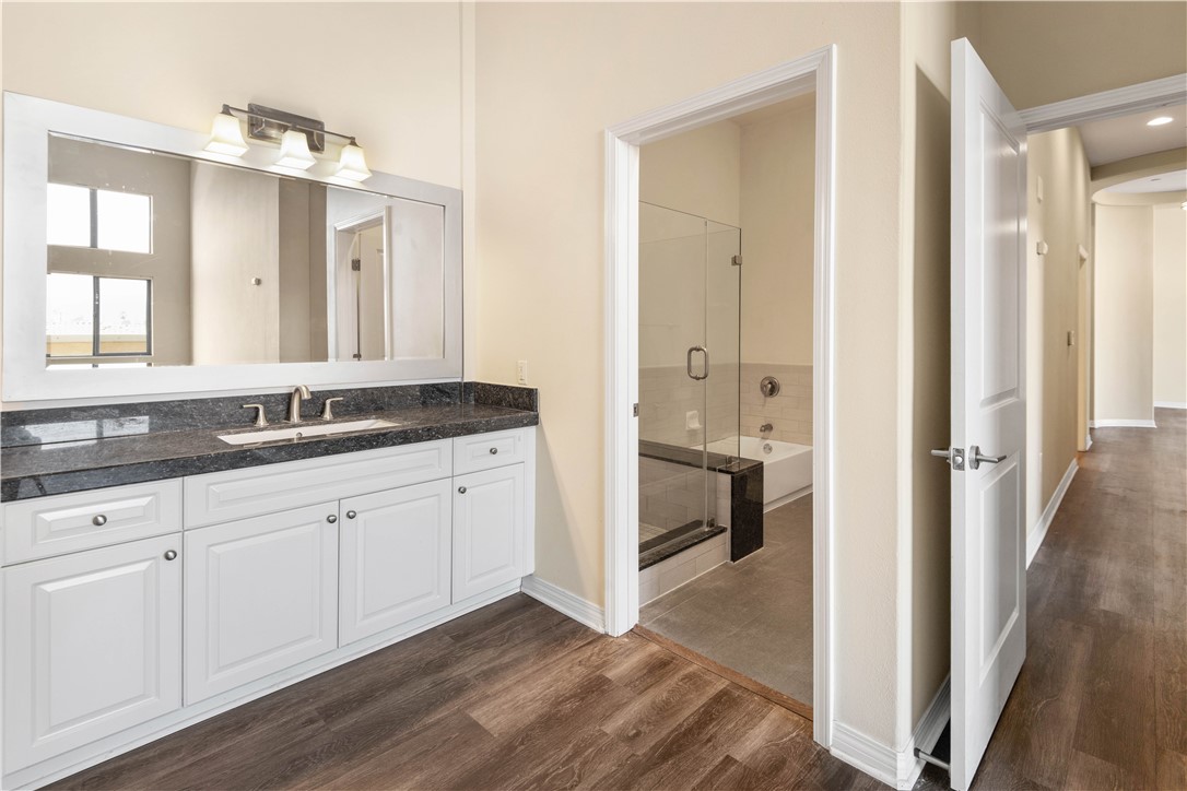 600 North Atlantic Boulevard, Unit 213 Monterey Park, CA 91754 - Photo 15 of 28 a spacious bathroom with a granite countertop sink and a mirror