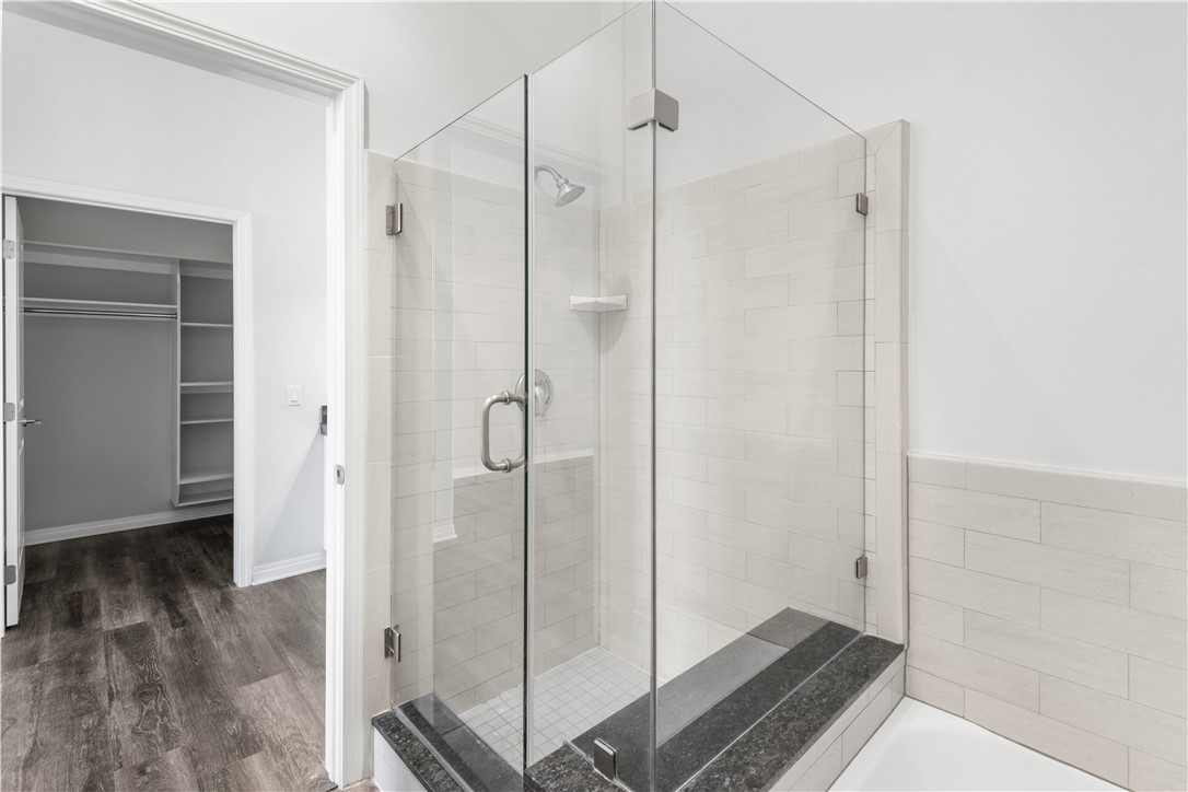 600 North Atlantic Boulevard, Unit 213 Monterey Park, CA 91754 - Photo 17 of 28 a bathroom with a glass shower door
