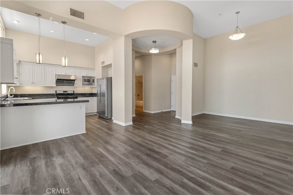 600 North Atlantic Boulevard, Unit 213 Monterey Park, CA 91754 - Photo 2 of 28 a kitchen with stainless steel appliances granite countertop a refrigerator and a stove top oven