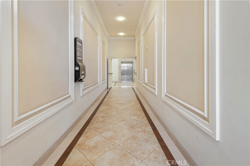 600 North Atlantic Boulevard, Unit 213 Monterey Park, CA 91754 - Photo 22 of 28 a view of a hallway with wooden floor and a bathroom