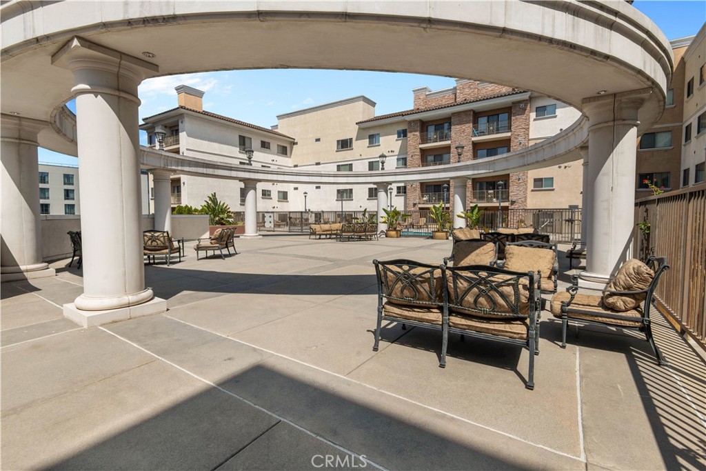600 North Atlantic Boulevard, Unit 213 Monterey Park, CA 91754 - Photo 26 of 28 a building outdoor space with patio furniture and a potted plant