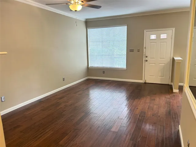 a view of a livingroom with an empty space and a fireplace