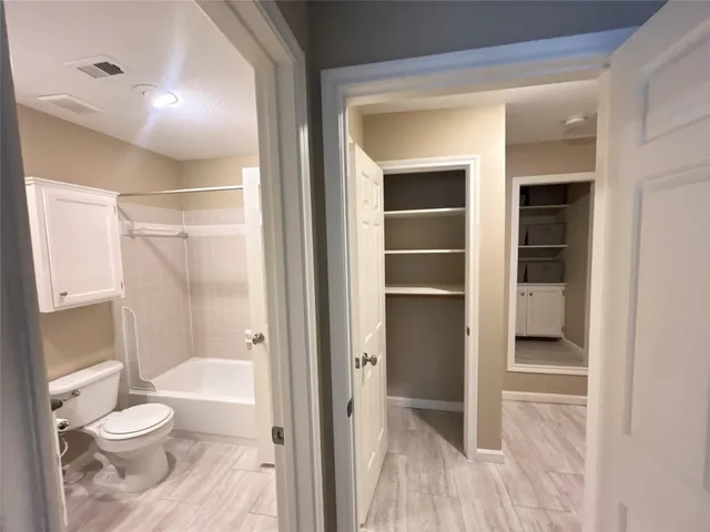a bathroom with a shower and a bathtub