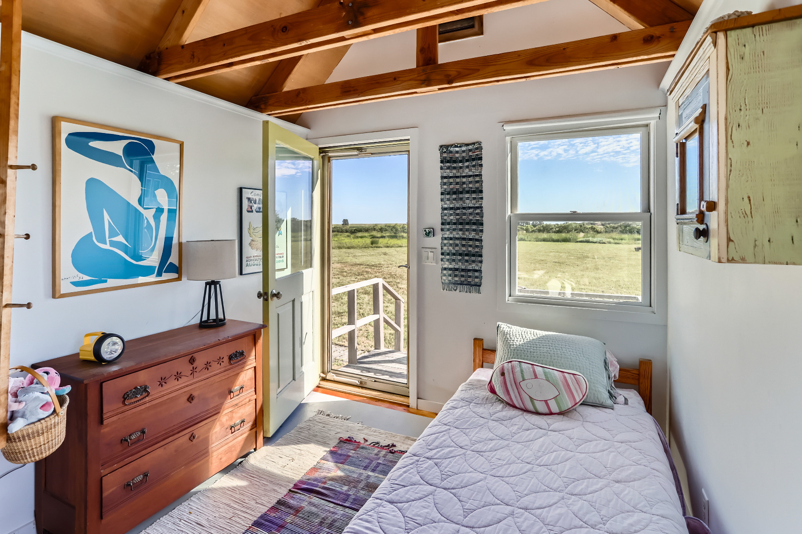 38 Black Point Road Chilmark, MA 02535 - Photo 19 of 38 a bedroom with a bed and wooden floor