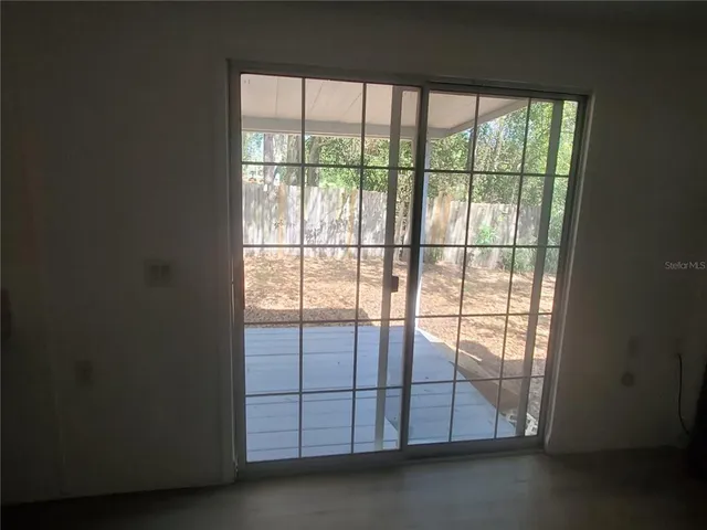 a view of a livingroom with an empty space and window