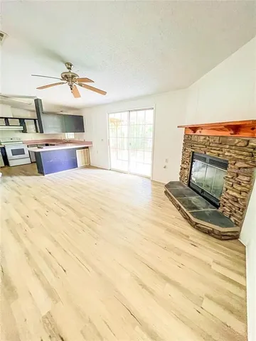 a swimming pool with a bed and a flat screen tv