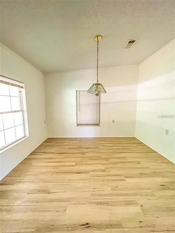 a view of an empty room and window