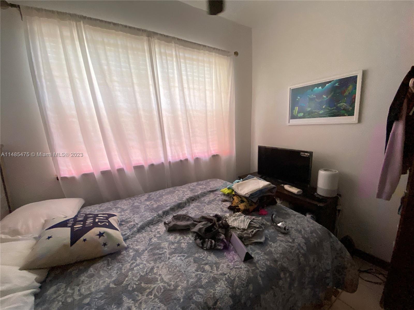 Biscayne Point Miami Beach, FL 33141 - Photo 9 of 20 a bedroom with a bed and a window