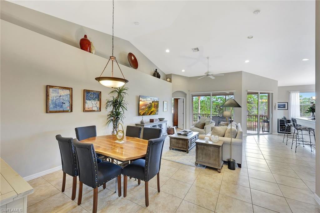 9110 Spanish Moss Way, Unit 422 Bonita Springs, FL 34135 - Photo 11 of 20 a view of a dining room with furniture